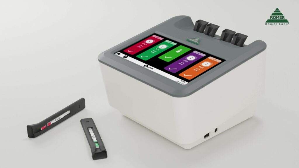 El lector de tiras AgraVision™ Pro  Reader es un lector-incubador que permite cuantificar in situ las micotoxinas en tan sólo 10 min de ensayo (incluida la extracción). Tiene 4 posiciones de lectura que pueden ser 4 muestras pudiendo hacer distintas toxinas a la vez. Para más información contactar con Bioser en el 932264477.